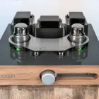 neoson amplifier sitting on light blue background